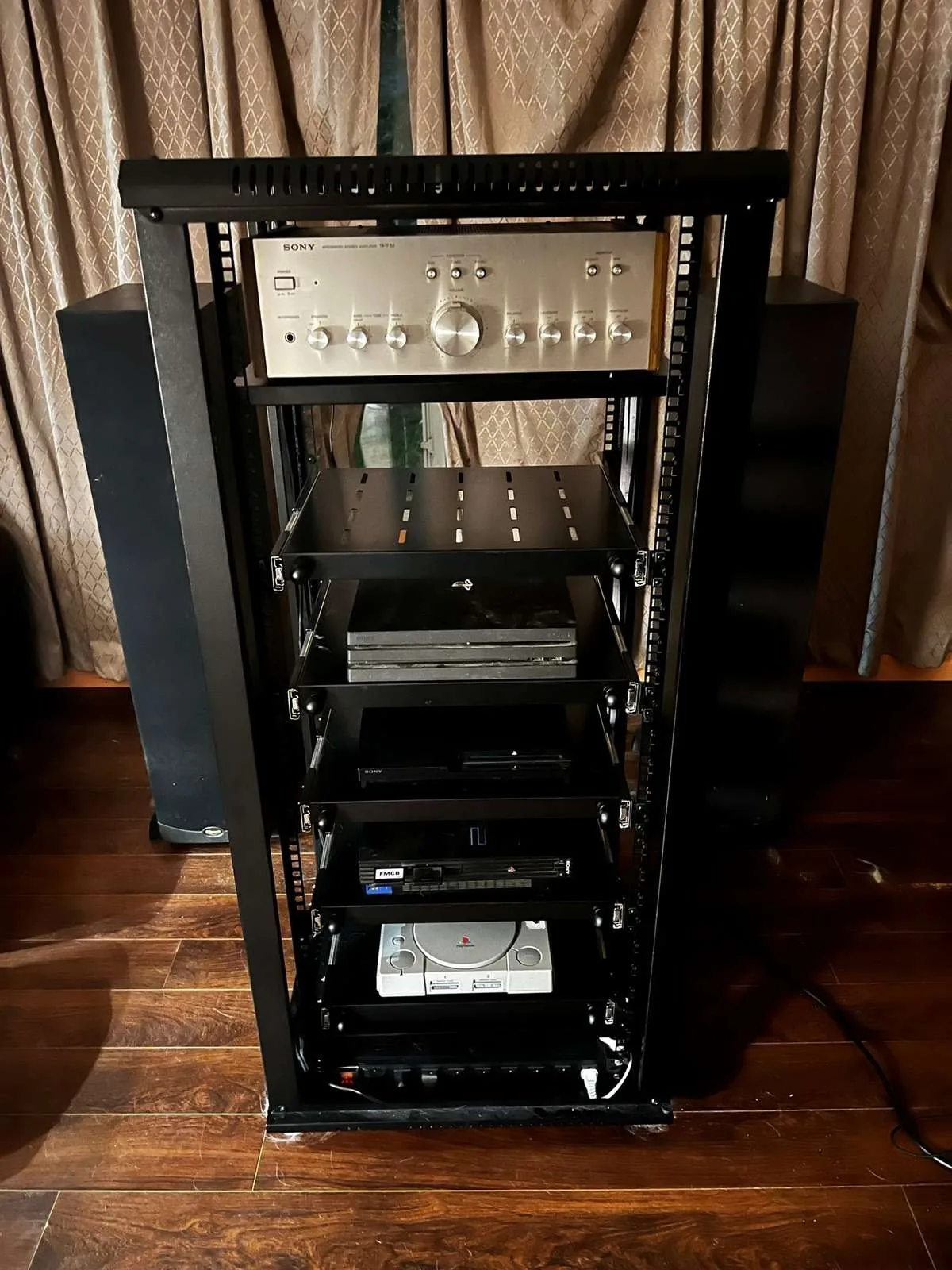 Unlit console rack showing the internal shelf arrangement
