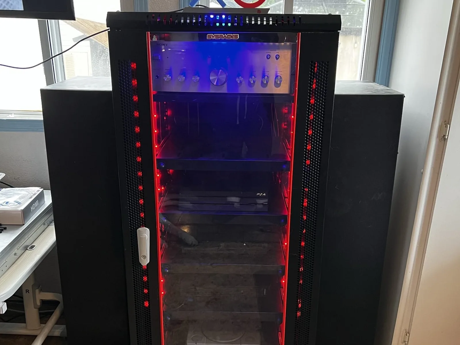 Open console rack with shelves and side panels visible